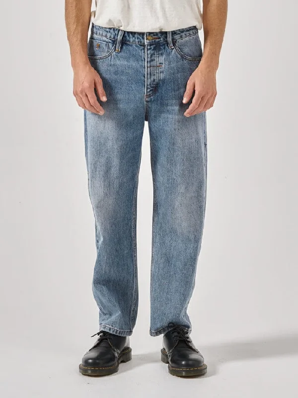 Men's Distressed Jeans with Patches for a Retro and DIY - Inspired AppearanceSlacker Denim Jean - Weathered Blue